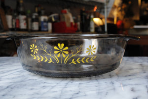 A 9" Round Vintage Glasbake Jeanette (unmarked) Casserole Dish in Smoked Brown with Yellow Daisies